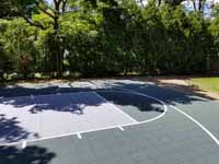 Rhode Island backyard basketball court on concrete base in Barrington. Shown here before any court upgrade work, old asphalt.