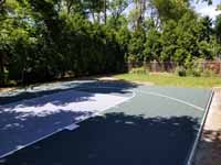 Rhode Island backyard basketball court on concrete base in Barrington.