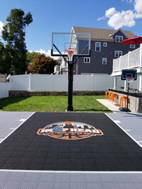Boston, MA residential basketball court in titanium and black, with custom Hoop Head logo.
