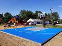 Royal blue and titanium basketball court for apartment complex residents in Dover, New Hampshire.