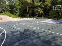 Large slate green and titanium basketball court in Easton, MA, with pickleball lines and shuffleboard.