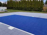 Titanium and navy blue residential basketball court in Hanson, MA.
