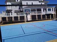Hingam Hockey and Basketball Court, looking through fence. We worked with the homeowner's landscape contractor for an amazing transformation.