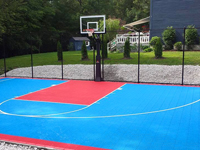 Light blue and red backyard basketball court installed in Hopedale, MA.