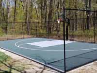 Backyard basketball court, in Versacourt slate green and titanium, in Stow, MA.