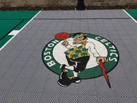 Closeup of Celtics logo on titanium colored background on key of  residential basketball court in Upton, MA.