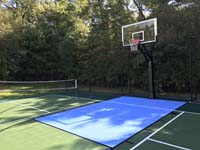 View near center of court lined for basketball and pickleball, showing both nets, in Westport, MA.