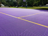Closer view of purple tile on resurfaced volleyball and basketball court at Williams Collage in Williamstown, MA. Apologies to the late Prince for the caption.