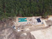 Aerial view to add context to multicourt with basketball, pickleball, shuffleboard and hoscotch as part of complete revamp of Yogi Jellystone Cranberry Campground in Cartver, MA.