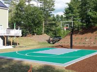 Residential basketball court with emerald green and titanium Versacourt surface in Bridgewater, MA.