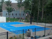 Overview of basketball and shuffleboard in blue and silver, integrated with pool deck and landscape in Wareham, MA.