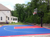 Backyard sport surface construction and basketball hoop installation in North Attleboro, MA.