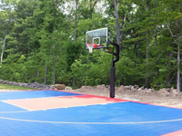 Focus on red key and basketball goal system on North Attleboro, MA cour.