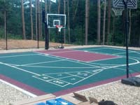 Backyard basketball court in Kingston, MA. Whatever your sport, you could have a court surface and accessories of your own.