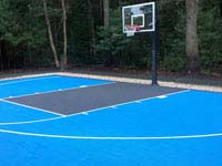 Light blue and graphite backyard basketball court installed in a yard like yours. Could be in Massachusetts, Rhode Island, Connecticut, New Hampshire, perhaps even Maine or Vermont.