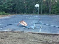 Destroyed Parsonage Road public basketball court in Plympton, MA before restoration.