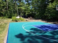 Jade green and blue Versacourt basketball tile on blacktop court in Rehoboth, MA.