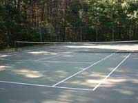 Run down commercial tennis court and multicourt at apartments or condos in Duxbury, MA.