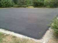 Blacktop surface ready for installation of large basketball court in Walpole, MA.