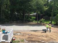 Cement poured, smoothed and waiting to cure for base of basketball court being built in West Bridgewater, MA.