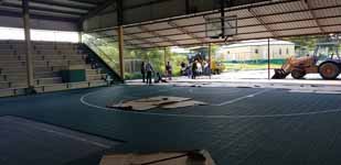 Picture from the process of resurfacing Antigua and Barbuda Basketball Association court and replaceing hoops at JSC Sports Complex in Piggotts, Antigua.