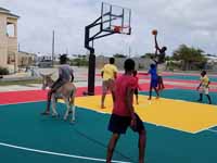 Replacement tennis and basketball courts in Codrington, Barbuda, courtesy of Australia, the Red Cross, and community effort, part of the ongoing recovery from hurricane Irma.Shown here, the new tennis court.