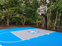 View from right side of light blue and titanium court with pirate logo in Bedford, MA.
