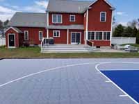 Titanium and navy blue residential basketball court in Hanson, MA.