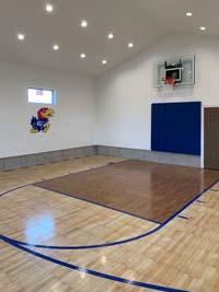 Example of indoor basketball court featuring two colors of wood look SnapSports surface.