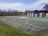 Basketball court resurfaced to include pickleball lines in Siasconset, MA, on Nantucket, at Sankaty Head Foundation Caddie Camp.