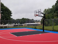 Municipal court in red, royal blue border, and black key, with new hoops and tile playing surface in Paxton, MA.