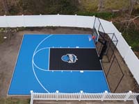Cape Cod residential backyard basketball court from side and overhead in South Yarmouth, MA.