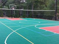 Home basketball court with tennis and volleyball in Pembroke, MA.