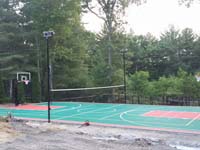 Pembroke, MA residential multiple-sport court in green and red low impact tiles.