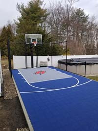 Blue  and grey backyard basketball court in Braintree, MA.