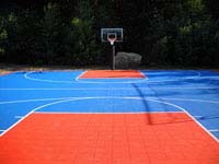 Large blue and orange backyard basketball court in Bellingham, MA.