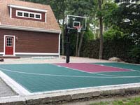 Small basketball court integrated with existing patio in Dartmouth, MA