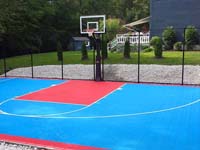 Light blue and red backyard basketball court installation in Hopedale, MA.
