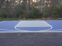 Navy blue and titanium court tiles installed on blacktop driveway in Plympton, MA.