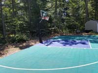 Jade green and blue Versacourt basketball tile on blacktop court in Rehoboth, MA.