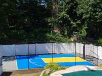 Royal blue and yellow basketball court and accessories in Stoneham, MA.