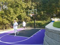 Custom purple basketball court designed for limited space in Stoneham, MA.