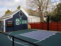 Backyard basketball court is the sort of thing you might find in Wakefield, MA or a yard like yours. Included are customer embellishments to their court area, with basketball rack, Celtics banners, and Larry Bird shirt.