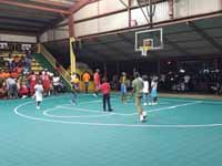 Resurfaced ABBA (Antigua and Barbuda Basketball Association) basketball court and replaced hoops at JSC Sports Complex in Piggotts, Antigua and Barbuda. Youngsters shooting hoops on new court before opening ceremonies.